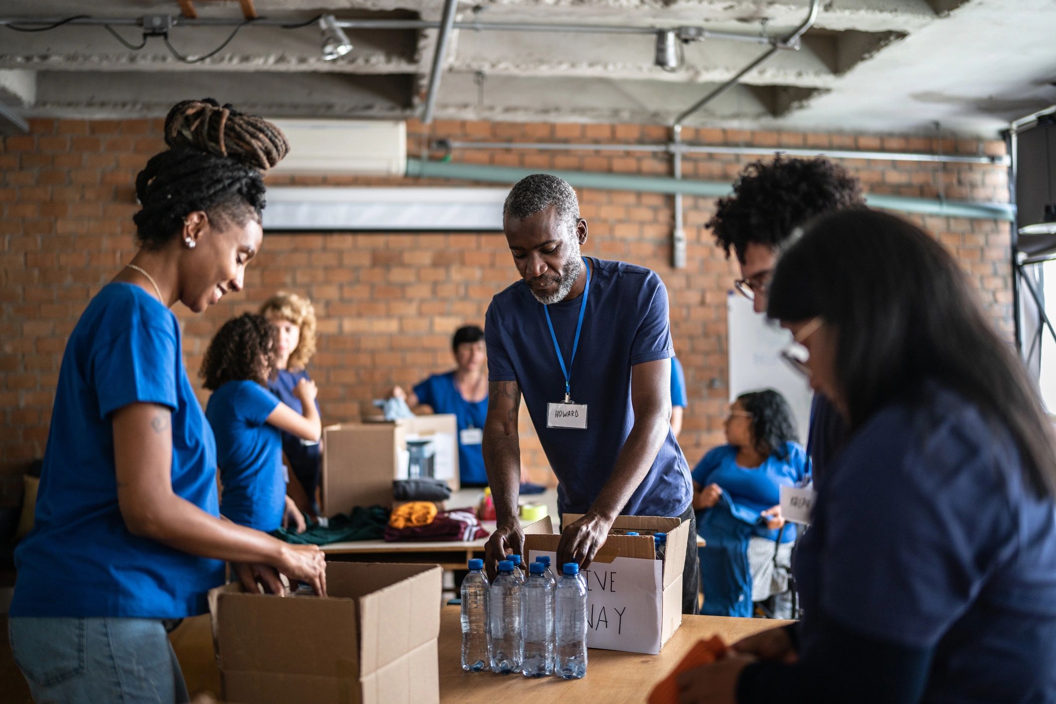 Volunteers sorting donated supplies for community members
